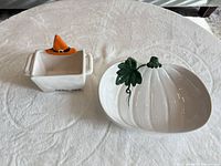 Pumpkin dish and witch hat candy dish side by side