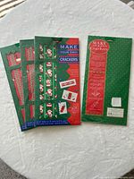 Front view of sealed Christmas cracker kit and sheet designs