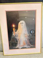 Framed ghost print showing entire piece with gold frame and pink mat