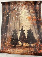 Canvas print with three witches walking in autumn forest, portrait orientation, edges curled