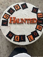 Overall view of wooden sign and banner placed on table