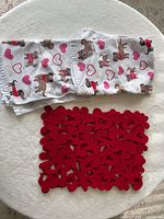 Folded dish towels and red felt mat group shot