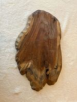 Front view of walnut live edge board showing grain and shape