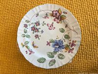 Front view of Mikasa Heirloom dinner plate showing floral pattern