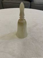 Full view of bell standing upright showing color and shape