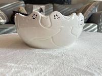 Side view showing ghost faces and scalloped rim