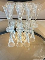 Front angle view of stacked arrangement showing all 11 clear cordial glasses