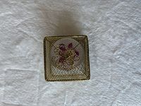 closed gold metal mesh box top view