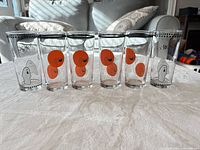 Front view of six Halloween tumblers showing ghost and spider designs