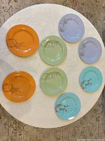 All eight plates displayed face up showing colors and rabbit graphics