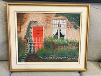 Full view of framed cottage landscape painting