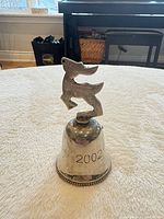 Bell upright showing reindeer finial and 2002 engraving