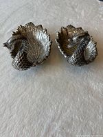 Front view of both swan dishes showing shape and finish