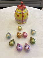 Ceramic jar with lid and 10 ornaments displayed