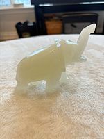 Full view of small white onyx elephant figurine