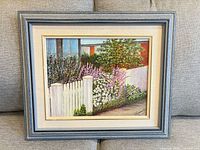 Front view of framed floral garden oil painting