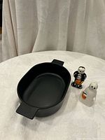 Villa black stoneware baking dish with ghost and skeleton shakers