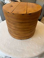 cylindrical wood cheese box side view showing bentwood seam and nails