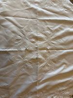 Full view of tablecloth showing embroidery and cutwork