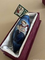 Blue glass ornament with Mary and Jesus painting in box
