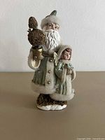 Front view of resin Santa figurine with angel