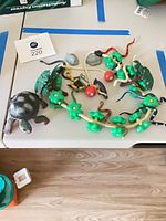 Overview of all toy animals and play pieces on table