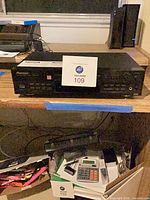 Full front view of Pioneer CD recorder on shelf