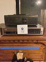 Kyocera CD player stacked beneath black boom box