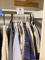 Front view of shirts on closet rod