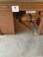 Front view of desk showing drawers and kneehole