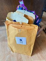 Overall view of box holding envelopes with decorations visible