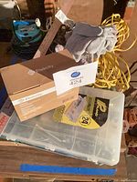 Overview of boxed Etekcity lanterns, organizer, gloves, cords, yardstick