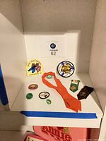 Shelf view showing all Girl Scout memorabilia pieces