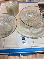 Overview of stacked dessert bowls, serving bowls and platter