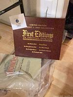 Maroon leather album and sealed Chronicles book