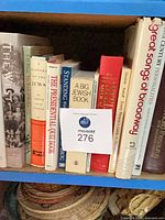 Front view of shelf row showing all book spines for title verification