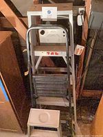 three ladders nested together showing heights and materials