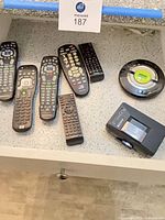 Group view of all remotes, Sony Walkman, and circular control puck