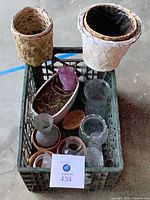 Top view of crate showing baskets, planter, pots and vases