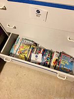 Open drawer showing large stack of Reader's Digest magazines