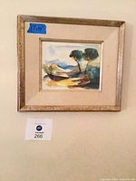Full view of framed watercolor painting on wall