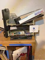 Overall view of desk organizer stack with binders, letter sorter, stationery