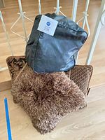 Group of four assorted throw pillows stacked together