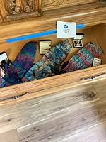 Drawer containing cummerbunds, bow ties, cufflinks and pocket squares