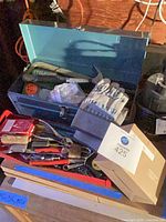 overall view: toolbox, hand tools, gloves, lantern boxes, lock, fasteners