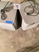 Top view of both Austin Health Mate air purifiers with cords visible