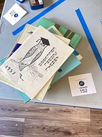 Stack of assorted yearbooks showing cover designs