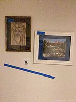 Both framed pieces on wall showing relative sizes