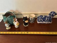 group shot of all six items with tape measure for scale