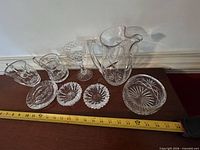 All eight crystal pieces lined up with measuring tape